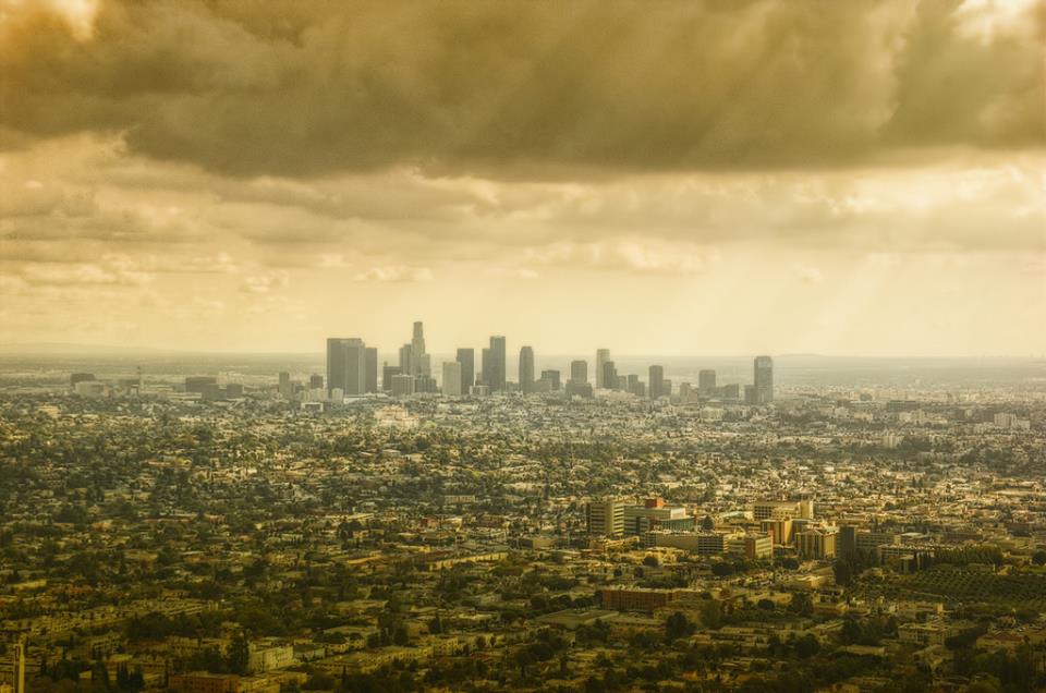 Downtown Los Angeles skyline under a golden storm sky